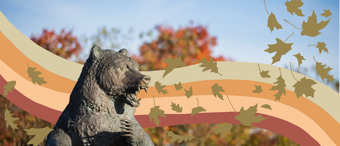 Statue of the Grizzly Bear on 韦德体育app官网's campus with illustrated rainbow 和 gold leaves